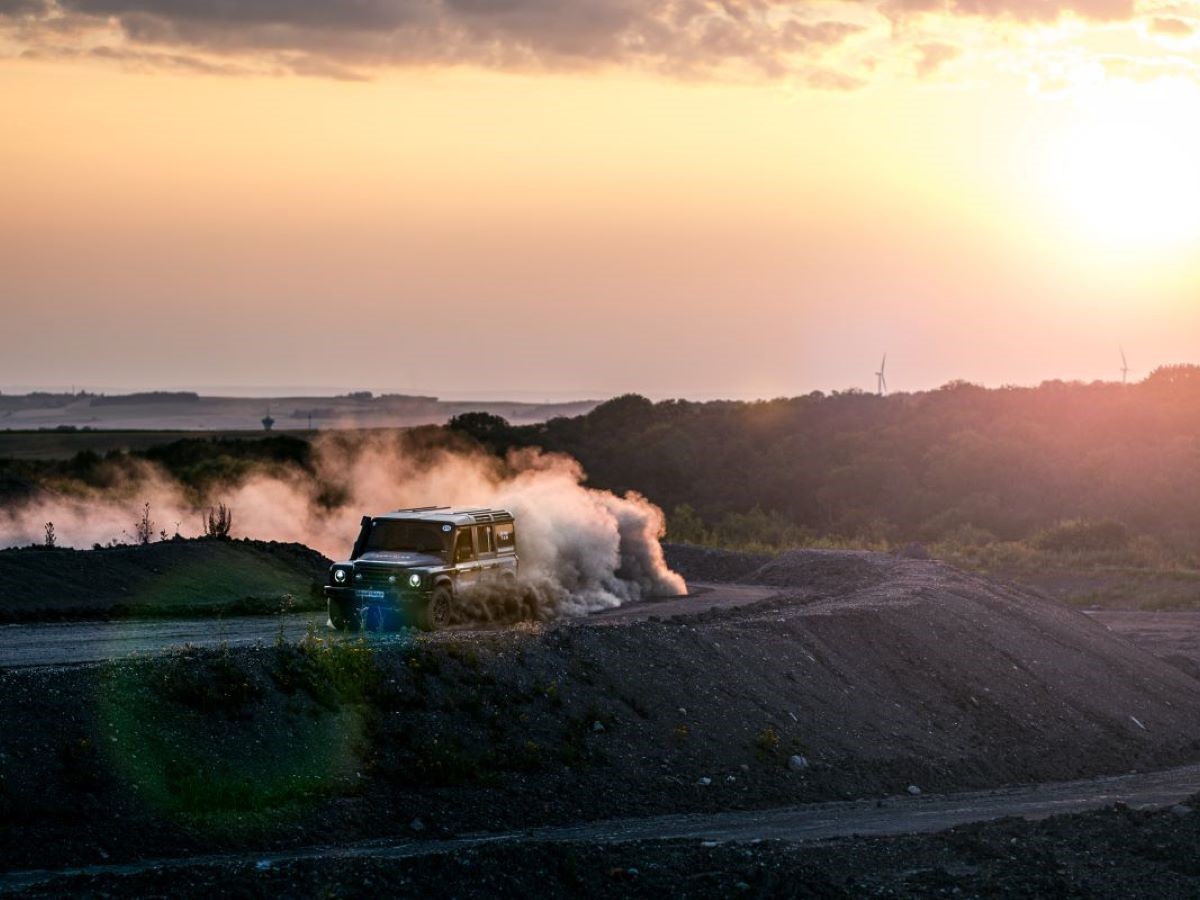 several off road vehicles camping in the desert